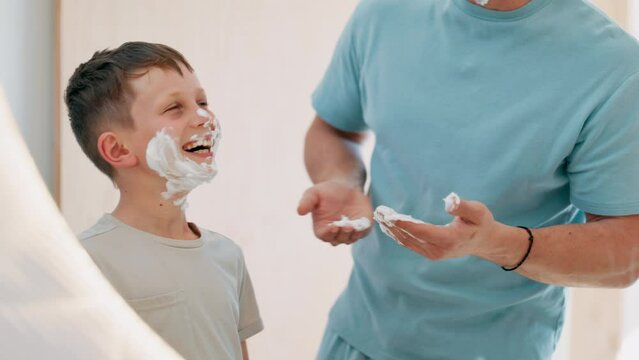 Man, child and shave learning in mirror for clean face, hygiene or masculine grooming practice. Male person, son and soap cream for health connection or childhood joy in bathroom, smooth or care foam