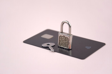 Financial fraud protection concept: credit card, padlock and master key.