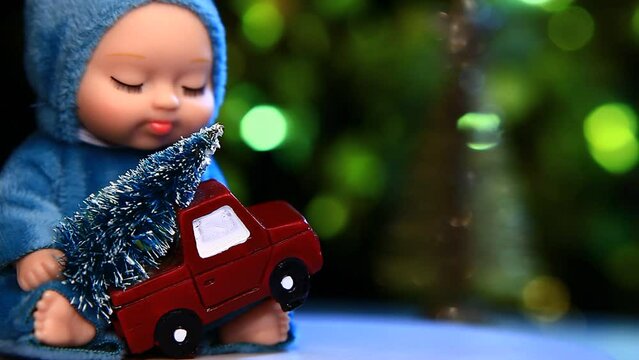 footage of doll new year toy truck gold fir tree dark background 