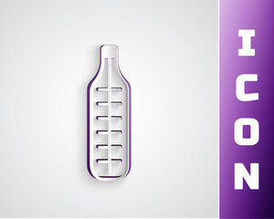 Paper cut Medical thermometer for medical examination icon isolated on grey background. Paper art style. Vector