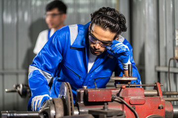 Professional team labor machanic engineer technician worker industrial work control with machine, manufacturing, factory, production line, Indusry 4.0, robot, industrial facility.business planning