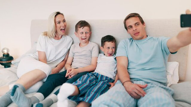 Happy family, selfie and smile in bedroom for love, profile picture and memory on bed of home or apartment. People, parents and children with phone or happiness for bonding, morning and care in house