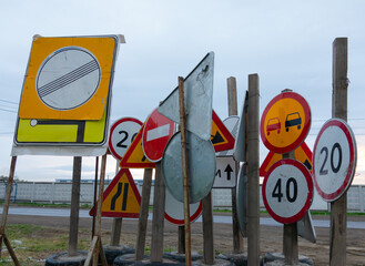 Many temporary road signs in one place