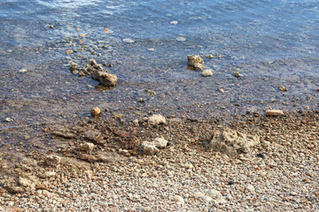 pebbles on the beach and waves