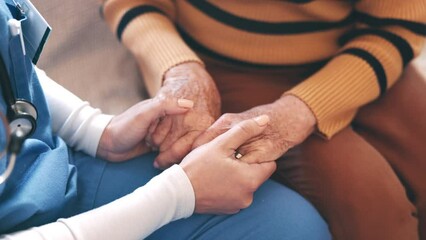 Senior, woman and nurse with holding hands for empathy, support and compassion on sofa of nursing home. Elderly, person or professional caregiver with sympathy, consulting and kindness for retirement