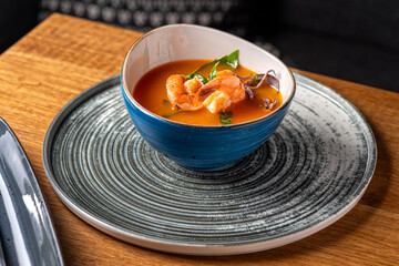 Traditional italian fish soup with shrimp, mussels and salmon. Tom yam kung with seafood.