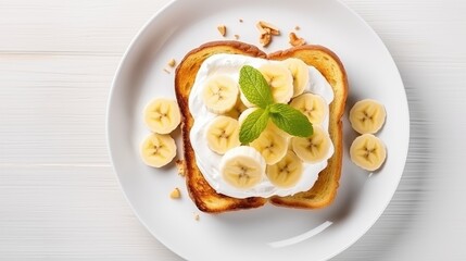 High angle of French Toast with Bananas on white wooden board.
