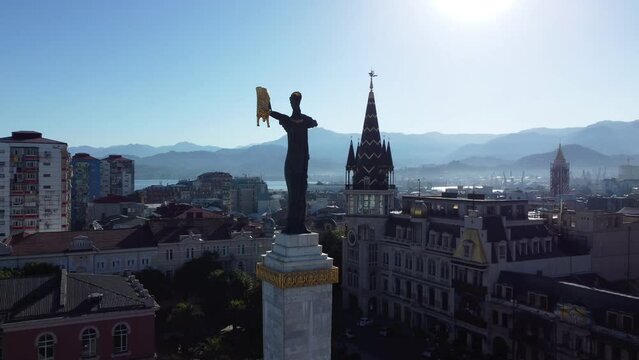 Aerial silhouette of the Medea and the Golden Fleece monument on Europe Square in Batumi, Georgia.