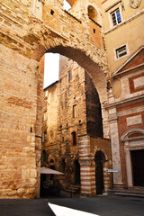 A close-up of the walls of an old arched passage in the city of Perugia