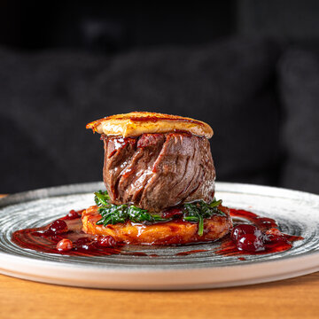 Tournedos Rossini with foie-gras. Fillet mignon steak Serving in the restauran.