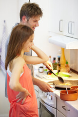 Young, couple and cooking of dinner in kitchen, together and bonding for relationship. Man, woman and talking by stove by preparation of yummy, delicious or meal for health, nutrition or diet in home