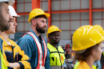 Portrait of engineers and industrial workers in hardhats at construction site