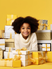 Little African-American girl wearing a sweater with lots of gift boxes for Christmas or birthday, 5 years old girl smiling looking at camera, vertical studio photo, yellow background