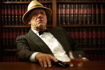 Man, mafia and boss or gun serious face for crime gangster, whiskey in office. Male person, hitman...