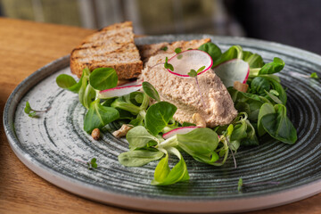 Canard Foie gras Pate made of the liver of a duck or goose with toasted bread slice.