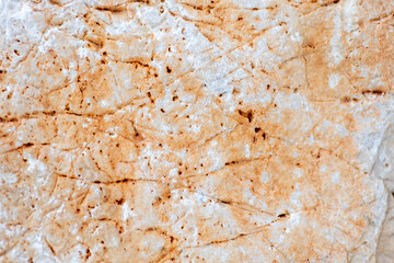 Colours, textures and patterns on a natural stone. Stone background.