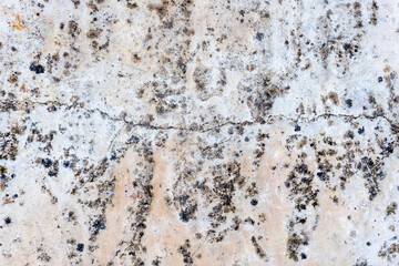 Colours, textures and patterns on a natural stone. Stone background.