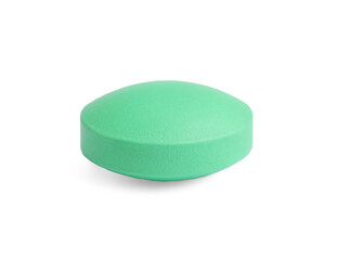 One light green pill on white background. Medicinal treatment