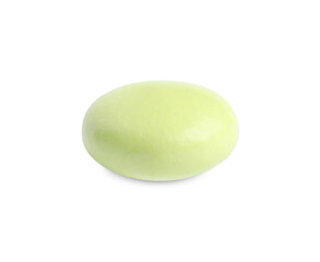 One light green pill isolated on white. Medicinal treatment