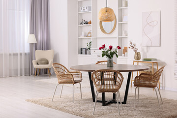 Fototapeta na wymiar Stylish dining room interior with comfortable furniture