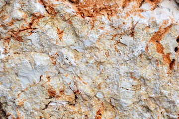 Colours, textures and patterns on a natural stone. Stone background.