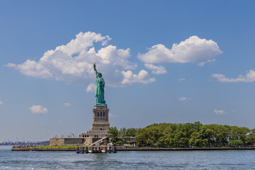 Fototapeta na wymiar Liberty Island and the Statue of Liberty as seen from a boat in New York City, USA