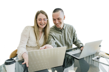 A young couple of female and male programmers use a laptop to work together. Employees of modern youth online work on the Internet. Transparent isolated background.