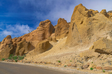 Lunar landscape in Teno Alto, with sunlight and blue sky with clouds background, in Tenerife, Canary islands