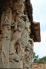 Hampi, Karnataka India - July 24 2023: Stone chariot at temple of Vijaya Vittala complex in desert valley of Hampi