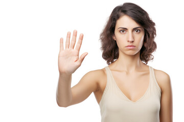 Fototapeta premium A young person using a stop gesture as a symbol of negative awareness and the rejection of harm.