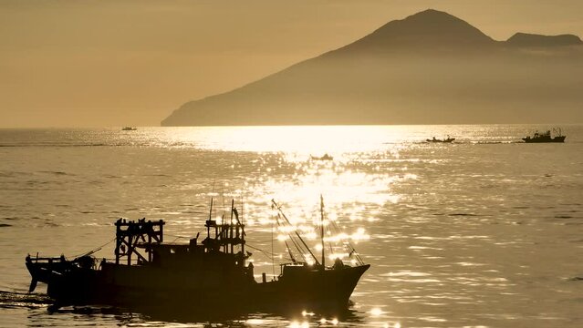 Silhouette Fishing boat with sunshine in the morning, Fishing in the Yilan,Taiwan.