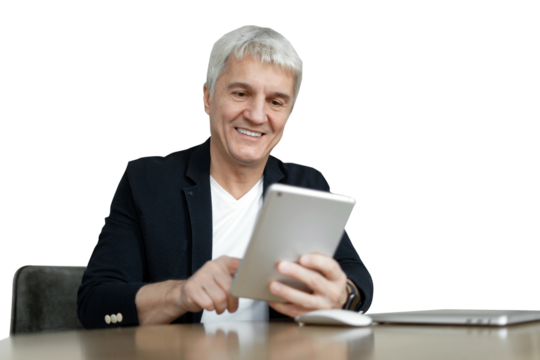 An adult male aged gray-haired in a jacket works online uses a tablet workplace. Transparent isolated background.