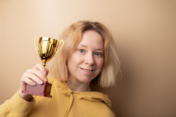 award, sport cup, success, trophy, first place, the winner of the competition holds a gold prize