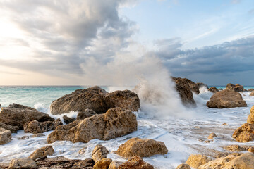 Big waves crushing on the big rocks on Kavalikefta Beach, Lefkada, Greece.