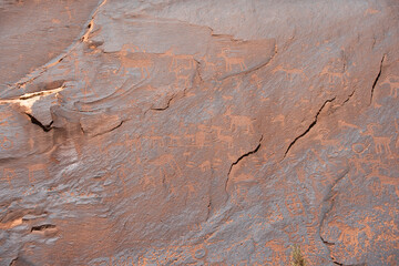 Detail of figures depicted on the wall of the  Sand Island Petroglyph Panel - obrazy, fototapety, plakaty