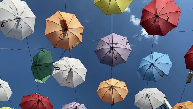 Installation of rain umbrellas against the blue sky. High quality FullHD footage