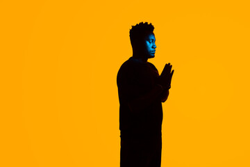 silhouette of person praying