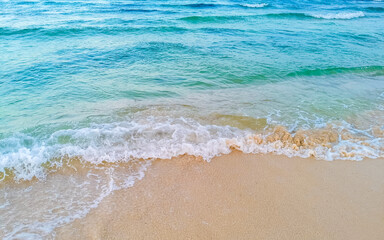 Fototapeta na wymiar Waves at tropical beach caribbean sea clear turquoise water Mexico.