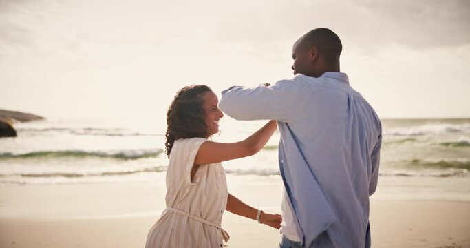 Couple, dance or beach spin or love connection, weekend romance or anniversary celebration. Black man, woman and fun moving at ocean for travel suns relax or tropical vacation, party or holiday trip