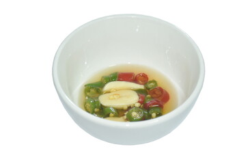 chop fresh chili and garlic in fish sauce with lime on cup