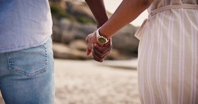 Love, couple holding hands at beach and trust in romantic connection, healthy relationship and bonding on holiday. Closeup, man and woman with support at ocean, back at sea and care on date in summer
