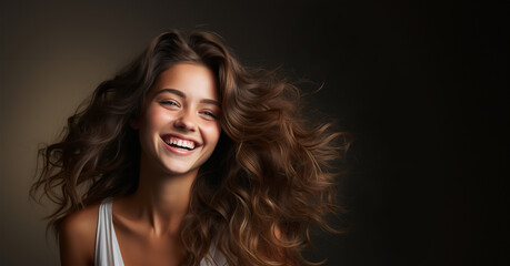 Healthy hair brunette advertisement model. Brunette girl Smiling beautiful model woman with long curly hairstyle. Care and beauty hair products Copy space