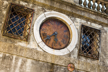 old clock on the wall of the house