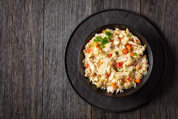 Chicken Fried Rice with vegetables in black bowl