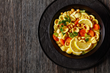 orecchiette pasta chickpea soup in black bowl