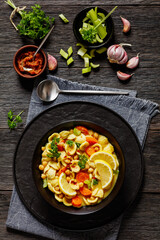 orecchiette pasta chickpea soup in black bowl