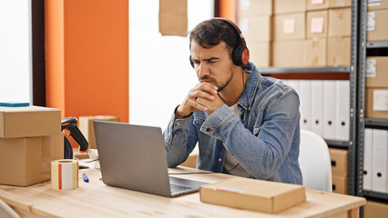 Young hispanic man ecommerce business agent having video call at office