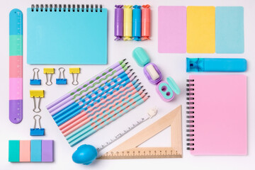 Stationery set for school on a white background. Bright stationery in pastel colors for students.