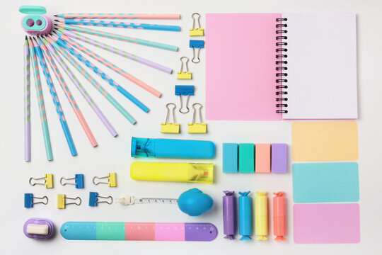 School supplies on white.Stationery on a white background. Bright stationery in pastel colors for students.