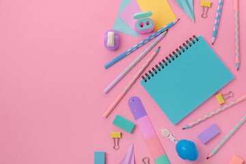 Back to school concept. Stationery on a pink background. Bright stationery in pastel colors for...